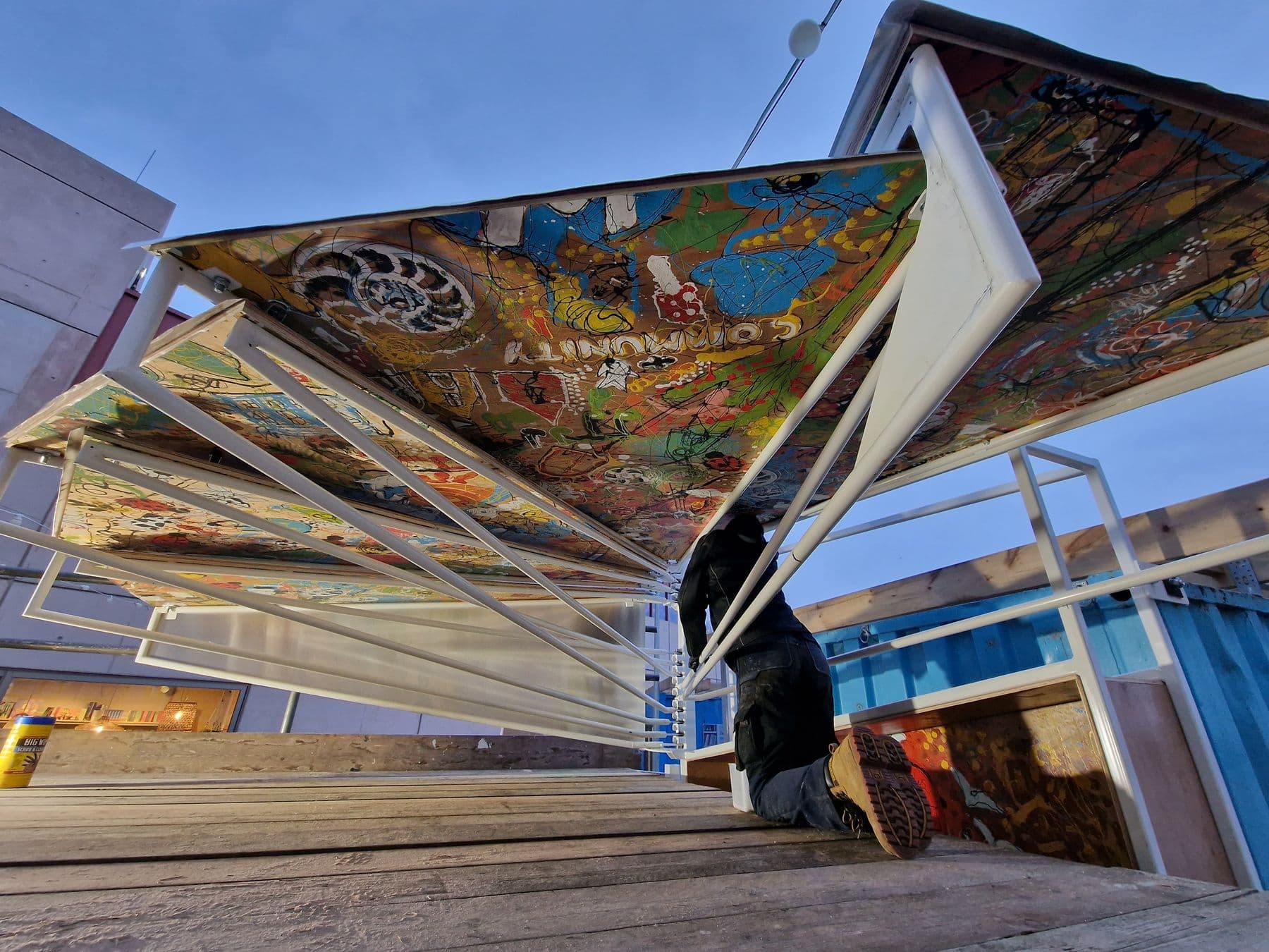 Hand-painted timber canopy panels of the Dog Walking Pavilion being installed at East Quay, Watchet