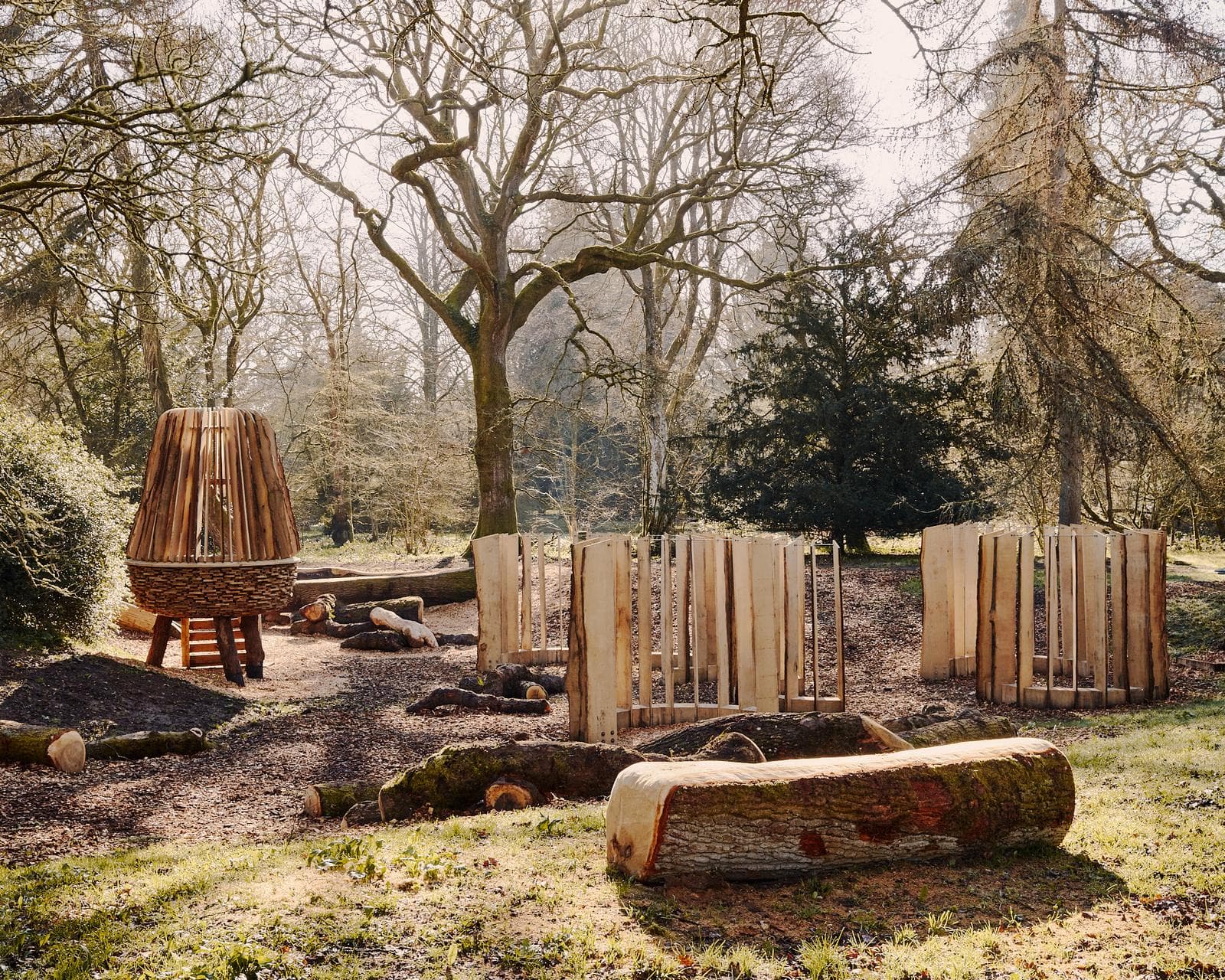 Green oak acorn watchtower and timber fence panels at the new play space, Westonbirt Arboretum
